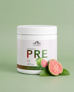PRE Guava Berry pre-workout tub with a fresh halved guava and leaves on a sage-green studio background