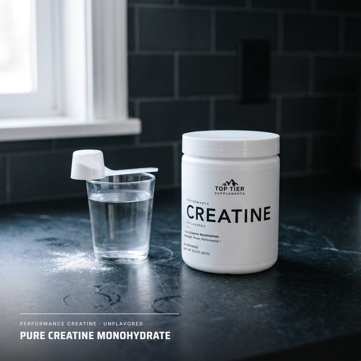 Top Tier Creatine Monohydrate tub on a kitchen counter beside a glass of water and scoop